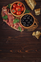 Plate with snack - prosciutto, jamon, ham.