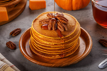 Stack of homemade pumpkin pancakes. © tbralnina