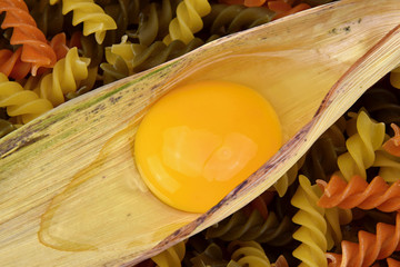 Yolk and albumen. Egg in a corn leaf and pasta. © faraonvideo