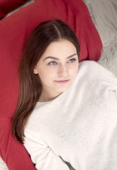 young woman lying on man's chest and smiling