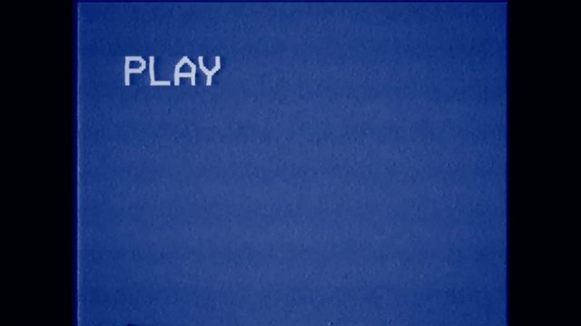 An old bad VHS tape playing. Blue screen with PLAY text only. A vintage background for videos, a retro element.
