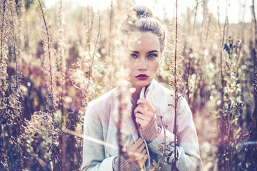 Fashion beautiful lady in autumn landscape