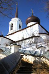The spire of the bell tower and the dome of the Cathedral of Dormition Svyatogorsk monastery....