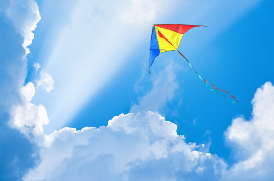 Kite flying in the sky among the clouds