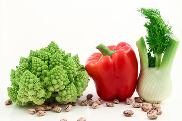 Organic vegetables and fruits in wicker basket isolated
