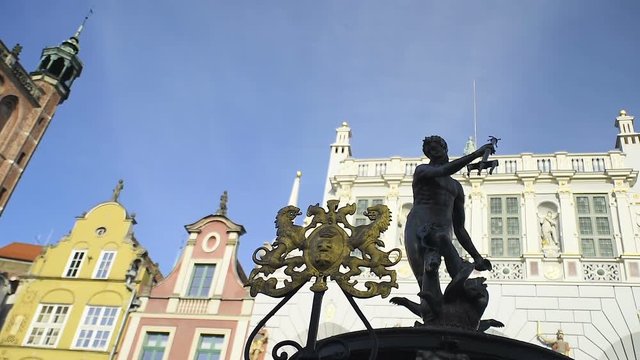 Slow slide with bronze Neptune statue in the old hansa town Gdansk, Poland