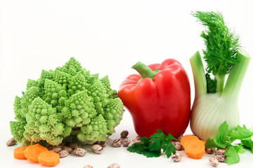 Organic vegetables and fruits in wicker basket isolated