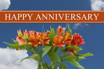 Happy Anniversary greeting with a orange and yellow lilies bouqu