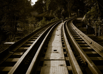 Railroad track curve around a bend in thailand