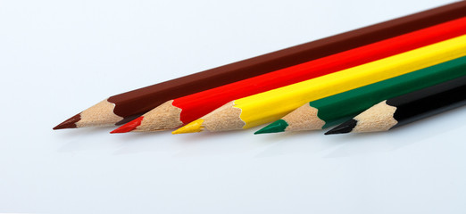 Colored pencils isolated over white background