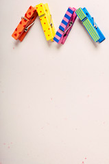 background with multi-colored wooden clothespins with patterns zigzag