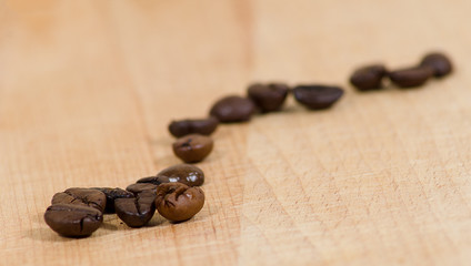 Coffee beans on a wooden surface