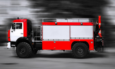 red fire truck in motion.