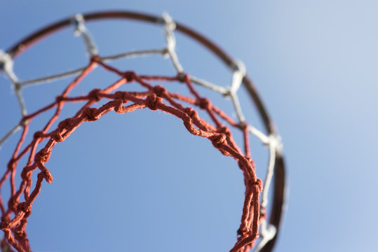 Toned photo. Basketball hoop against the sky.