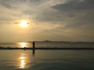 girl yoga seaside poolside silhouette