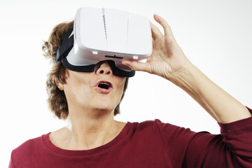 Senior woman with virtual reality headset.