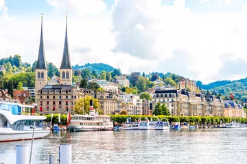 Foto op Plexiglas Cityscape view on the riverside with catholic church in Lucerne city in Switzerland © rh2010