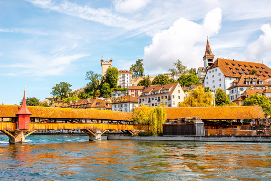 Cityscape view on the old wooden bridge and a riverside in Lucerne old town in Switzerland