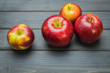 Whole green red ripe apples autumn harvest from above on dark gray blue wooden table