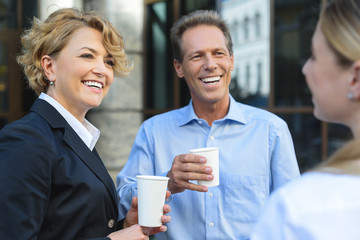 Coworkers talking outdoors