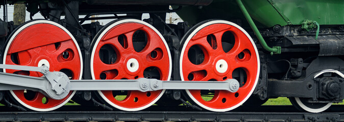Front locomotive view. Close-up shoot of big loco wheels