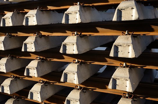 Stack of concrete railway sleepers background