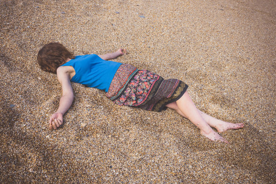 Young woman on pebble beach