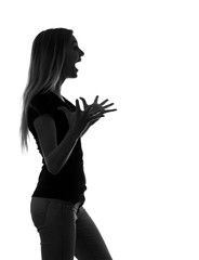 black and white silhouette of a very emotional young woman surprised than deeply about the list of joyful