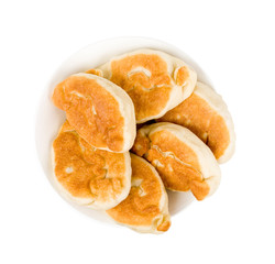 homemade fried russian pastries (pirogi) pies on plate, isolated on white backgroud, Russian traditional food