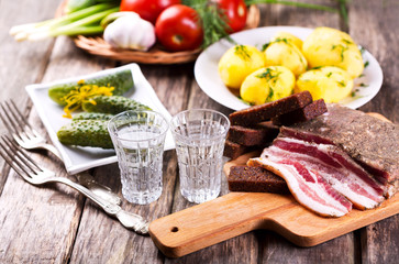 glasses of vodka with traditional snack