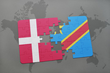 puzzle with the national flag of denmark and democratic republic of the congo on a world map background.