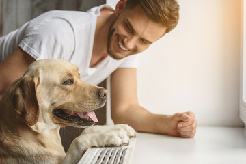 dog playing with a guy