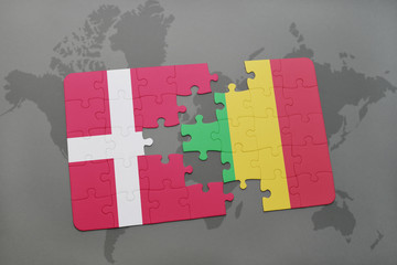 puzzle with the national flag of denmark and mali on a world map background.