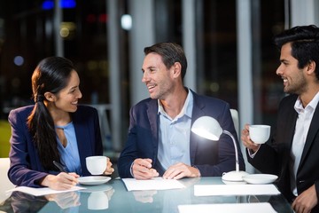 Group of businesspeople interacting with each other