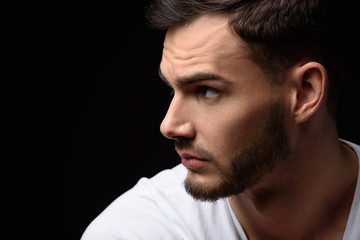 handsome guy looking at nine o'clock