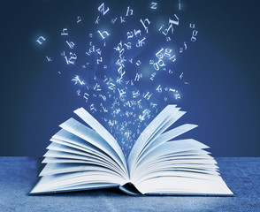 alphabet letters around open book