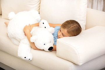 Cute child napping with soft toy