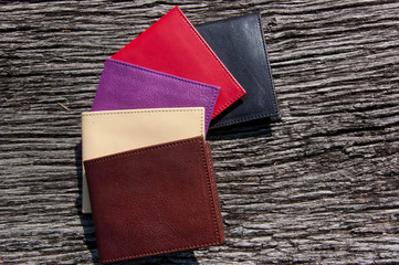 Leather wallets on a wooden table