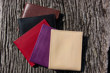 Leather wallets on a wooden table