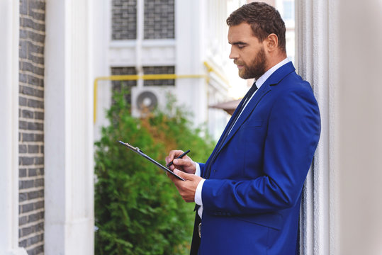 salesman standing with a tablet