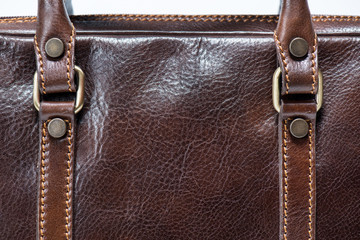 brown leather bag with straps