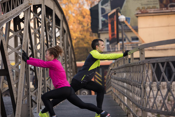 Fototapeta na wymiar couple warming up before jogging