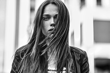 Street fashion concept. Young beautiful model in the city.