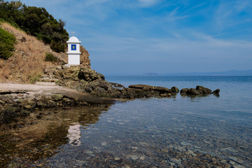 Small church on Agios nikolaos Kanistrou bay, Greece