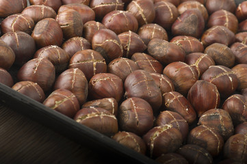 group of chestnuts on a wooden table