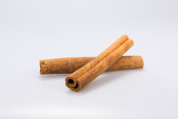 2 isolated Cinnamon sticks