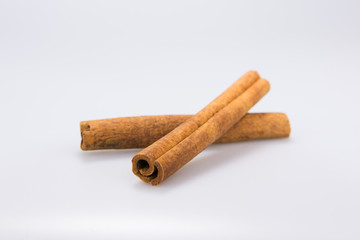 2 isolated Cinnamon sticks