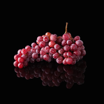 Bunch Of Red Grapes Isolated On Black