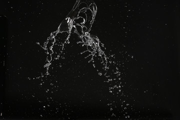 Fototapeta premium Water and air bubbles in space. Close up. Black background