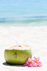 Tropical fresh cocktail on white beach